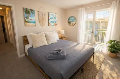 a bedroom with a bed with a towel on it at Marina del Rey 2BR-2BA Oasis Near Venice Beach Boardwalk in Los Angeles