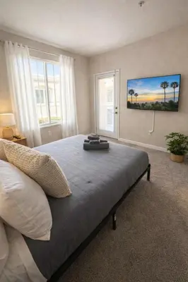 a bedroom with a large bed and two windows at Marina del Rey Prime 2BR-2BA Location Near Venice Beach in Los Angeles