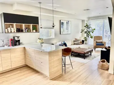 a kitchen and a living room with a couch at Modern 3Bedroom 3Bath Townhouse in Sherman Oaks