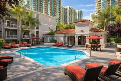 a swimming pool with chairs and a building at Marina del Rey 1BR Getaway & Close To Venice Beach in Los Angeles
