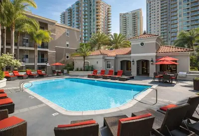 an outdoor swimming pool with chairs and tables at Marina del Rey 1BR Getaway & Close To Venice Beach in Los Angeles