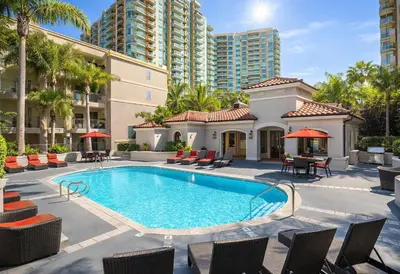 a swimming pool with chairs and a building at SereneStays Marina Del Rey Getaway - Right By The Marina in Los Angeles