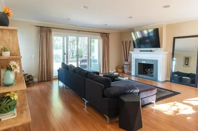 a living room with a couch and a fireplace at Beautiful Monterey Park Home With a View, Backyard and BBQ in Monterey Park