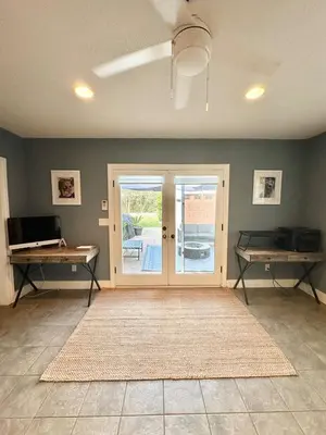 a living room with a sliding glass door at Altadena Retreat Near Rose Bowl and Pasadena in Altadena
