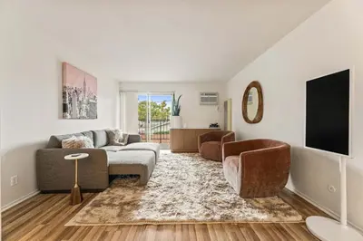 a living room with a couch and a tv at Elegant Luxe Hampton inspo Retreat in Glendale, CA in Glendale