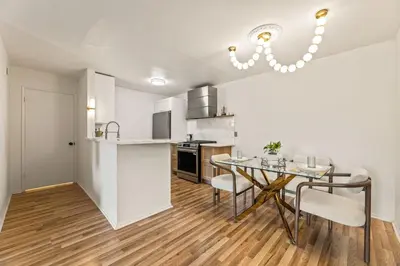 a kitchen and dining room with a table and chairs at Elegant Luxe Hampton inspo Retreat in Glendale, CA in Glendale