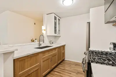 a kitchen with a sink and a stove at Elegant Luxe Hampton inspo Retreat in Glendale, CA in Glendale