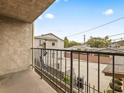 a balcony with a view of a parking lot at Elegant Luxe Hampton inspo Retreat in Glendale, CA in Glendale