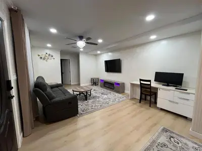 a living room with a couch and a table at Modern Family 3BR Near LAX & Disney in Torrance