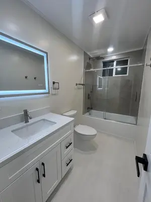 a white bathroom with a sink and a toilet at Modern Family 3BR Near LAX & Disney in Torrance