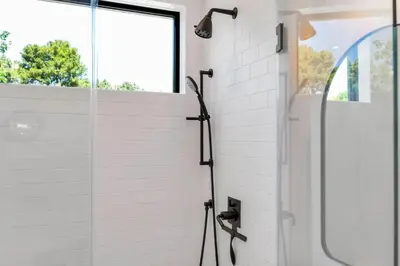 a shower with a glass door in a bathroom at NEW Venice Rose Ave Retreat with Sunset Deck in Los Angeles