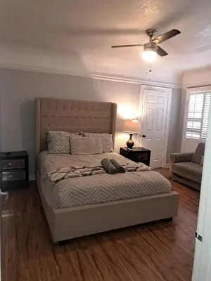 a bedroom with a bed and a ceiling fan at 3 bedroom plus 2 baths in Beverly hills in Los Angeles