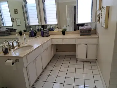 a bathroom with a sink and a large mirror at 3 bedroom plus 2 baths in Beverly hills in Los Angeles