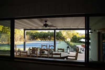 a view of a tennis court through a window at Luxury Ojai Escape Pool, Jacuzzi & Tennis Court in Ojai