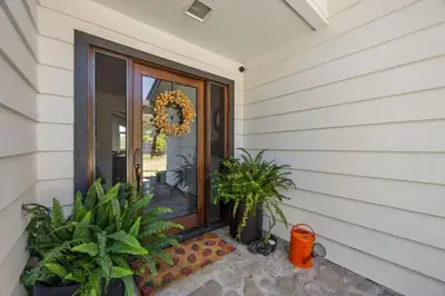 a front door of a house with potted plants at Luxury Ojai Escape Pool, Jacuzzi & Tennis Court in Ojai