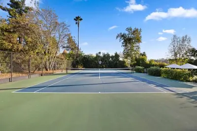 a tennis court with a net on it at Luxury Ojai Escape Pool, Jacuzzi & Tennis Court in Ojai