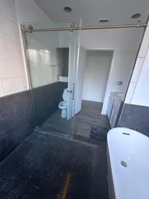 a bathroom with a shower and a toilet and a sink at Pet Friendly Private Guest Suite in Northridge in Northridge