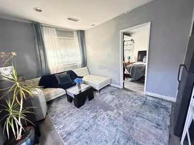 a living room with a couch and a table at Pet Friendly Private Guest Suite in Northridge in Northridge