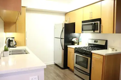 a kitchen with a stove and a refrigerator at Santa Monica Place with Free Parking in Los Angeles