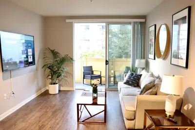a living room with a couch and a table at Santa Monica Place with Free Parking in Los Angeles