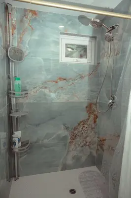 a bathroom with a painting on the wall at Beach House by LA Coast in Torrance
