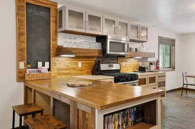 a kitchen with a wooden counter top in a room at Ursa Major Lodge | Walk to Lake & Village | Pet Friendly Retreat in Big Bear Lake