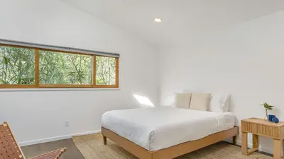 a white bedroom with a bed and a window at The Malibu Ranch Retreat by AvanStay Malibu Escape • Valley Views Near Zuma The Ranch Malibu in Malibu