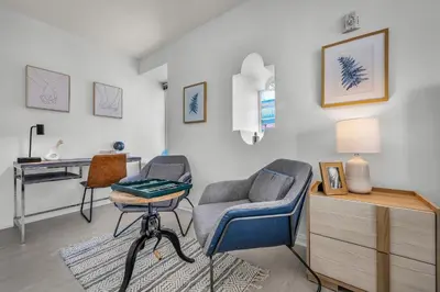 a living room with two chairs and a desk at Grand Studio On The Promenade Free Parking in Los Angeles
