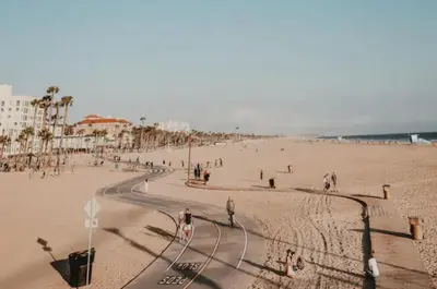 a group of people walking on a beach at Grand Studio On The Promenade Free Parking in Los Angeles