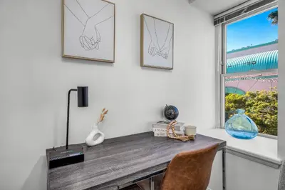 a dining room table with two chairs and a window at Grand Studio On The Promenade Free Parking in Los Angeles