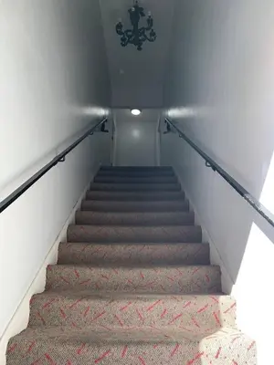 a staircase in a building with a chandelier at Charming 1 bedroom apt in Beverly Hills in Los Angeles