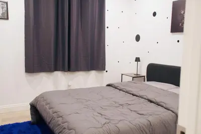 a bedroom with a bed and a window at The Warmwood Retreat in Los Angeles