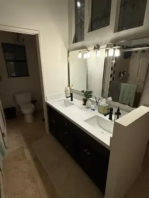 a bathroom with two sinks and a large mirror at Venice beach in Los Angeles