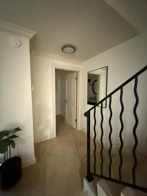 a hallway with a staircase in a house at Venice beach in Los Angeles