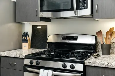 a kitchen with a stove and a microwave at Brilliant 2BD condo in Los Angeles
