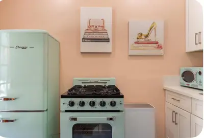 a kitchen with a stove and a refrigerator at Zen guess house in Los Angeles