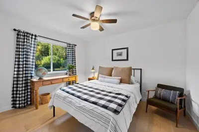 a bedroom with a bed and a ceiling fan at Private Estate with Cottage, Pool & Tennis in Ojai
