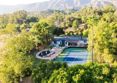 an aerial view of a house with a tennis court at Private Estate with Cottage, Pool & Tennis in Ojai