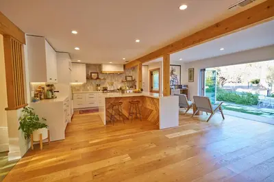 a large kitchen with wooden floors and a large window at Rancho Palomar in Ojai