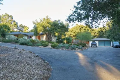 a house with a car parked in a driveway at Rancho Palomar in Ojai