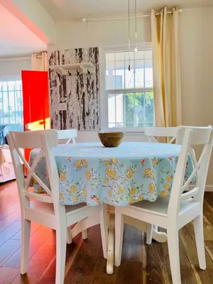 a dining room table with a blue table cloth on it at Beach House in Los Angeles