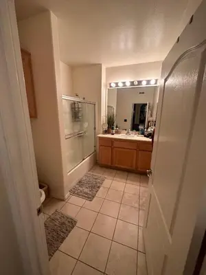 a bathroom with a shower and a sink and a mirror at Spacious 1B 1B Pool View Loft Apartment in Marina Del Rey in Los Angeles