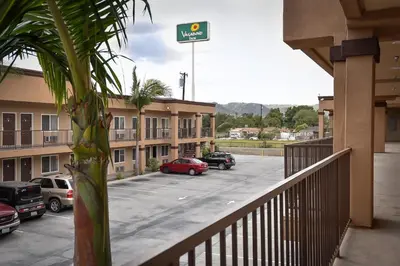 a balcony with a parking lot with cars parked at Vagabond Inn Hacienda Heights in Hacienda Heights