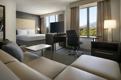 a hotel room with a bed and a desk at Residence Inn by Marriott Los Angeles Pasadena/Old Town in Pasadena