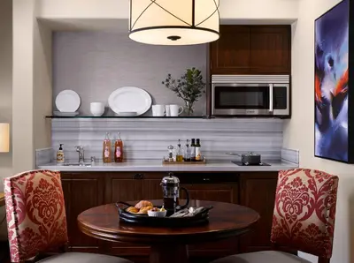 a kitchen with a table with a plate of food on it at Plaza la Reina in Los Angeles