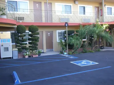 a parking lot in front of a building at Fullerton Lodge in Fullerton