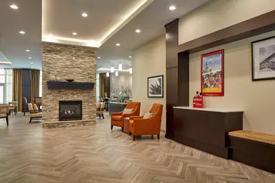 a waiting room at a hospital with a fireplace at Staybridge Suites Anaheim At The Park by IHG in Anaheim