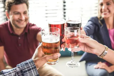 a group of people holding glasses of beer at Staybridge Suites Anaheim At The Park by IHG in Anaheim