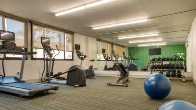 a gym with several exercise bikes and a blue ball at Holiday Inn Express Fullerton-Anaheim by IHG in Fullerton