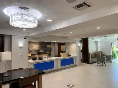 a large room with a kitchen and a chandelier at Holiday Inn Express & Suites Woodland Hills by IHG in Woodland Hills